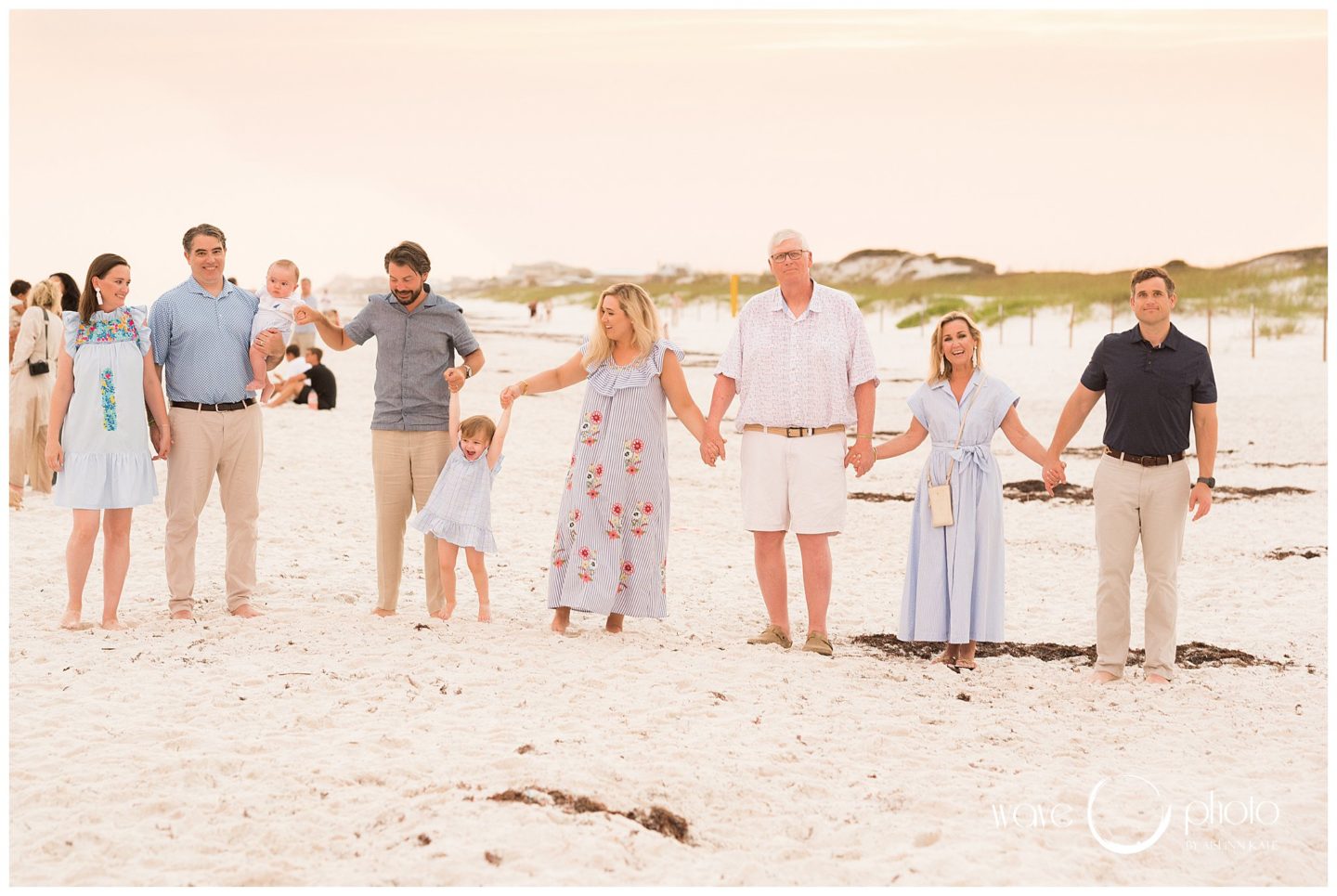 family-holding-hands-on-beach-30A-florida
