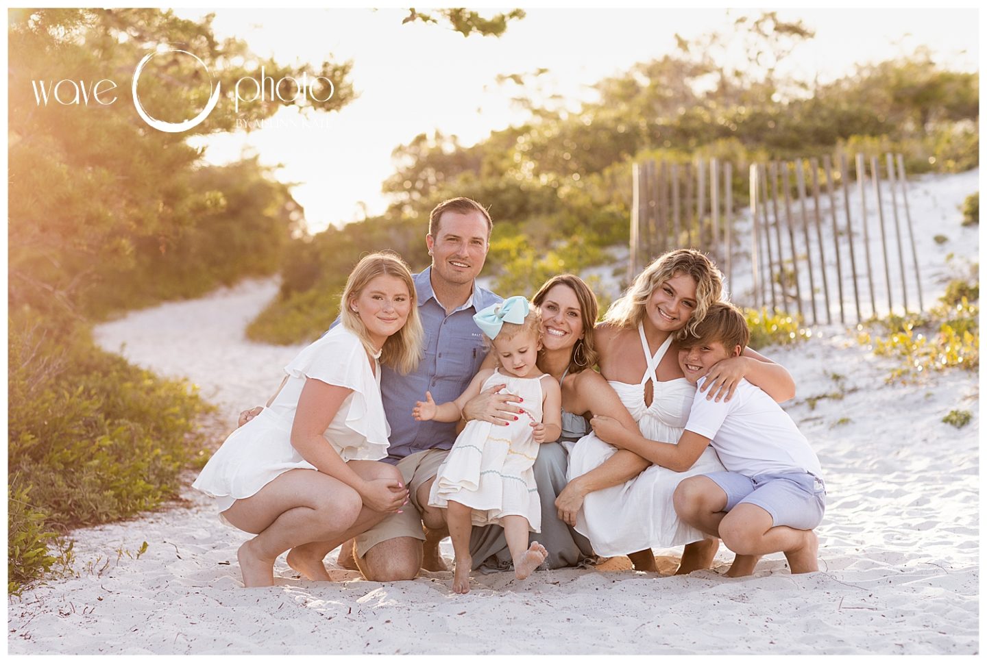 family-hugging-in-dunes-on-beach-destin-florida