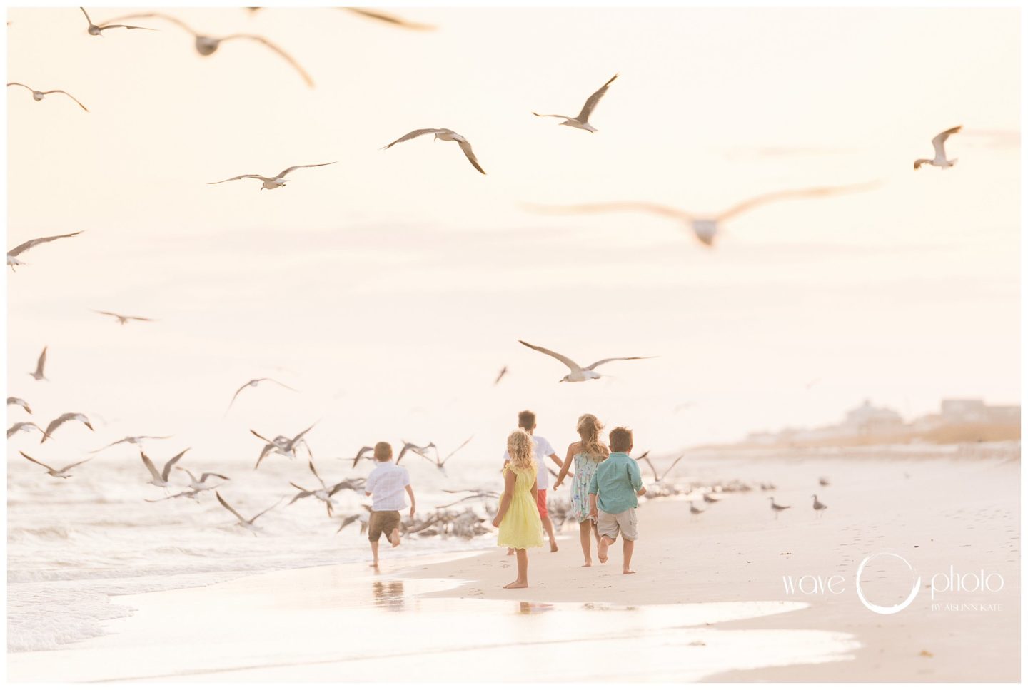kids-running-on-beach-chasing-birds-gulf-shores-orange-beach-florida