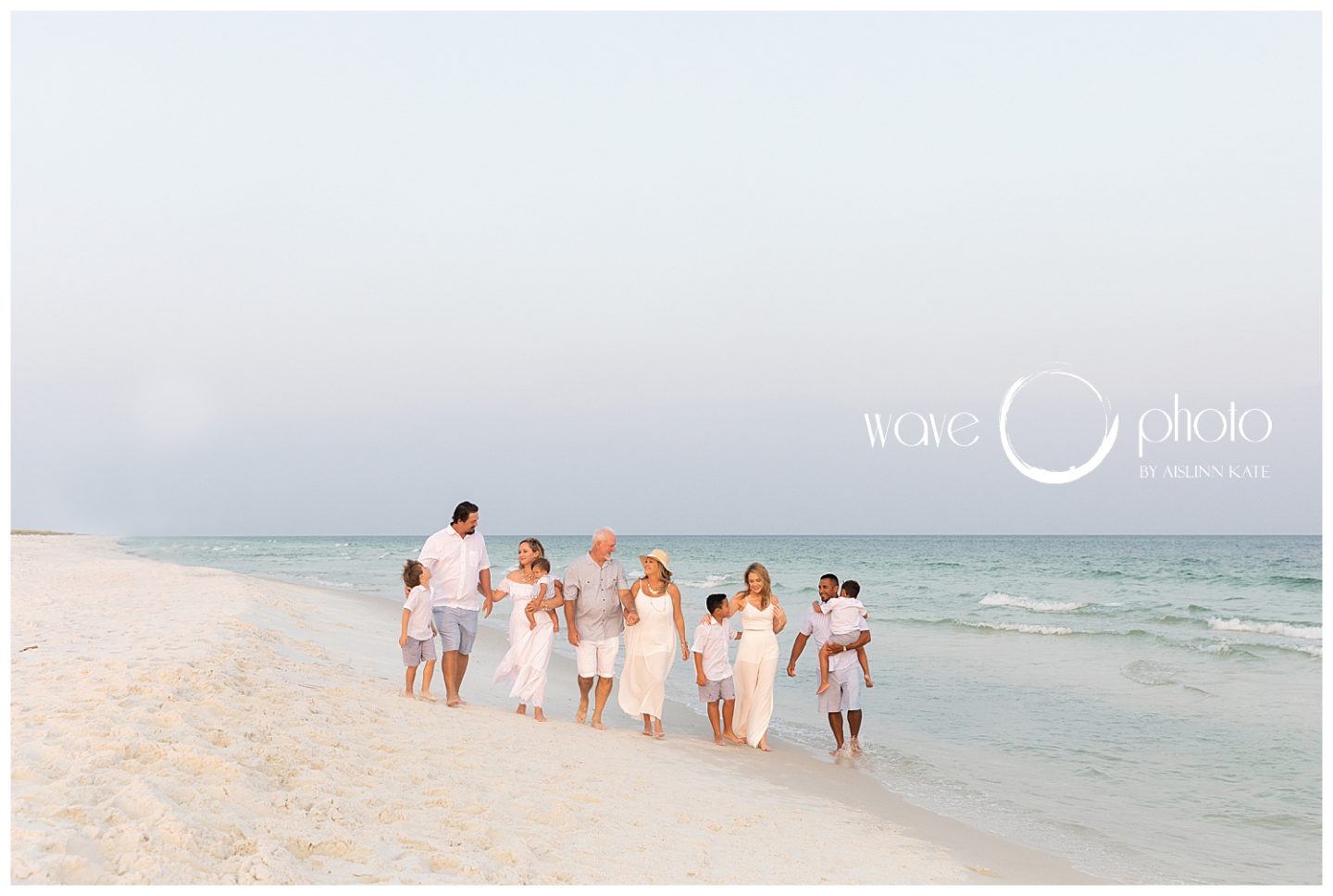 large-family-holding-hands-on-beach-walking-pensacola-beach