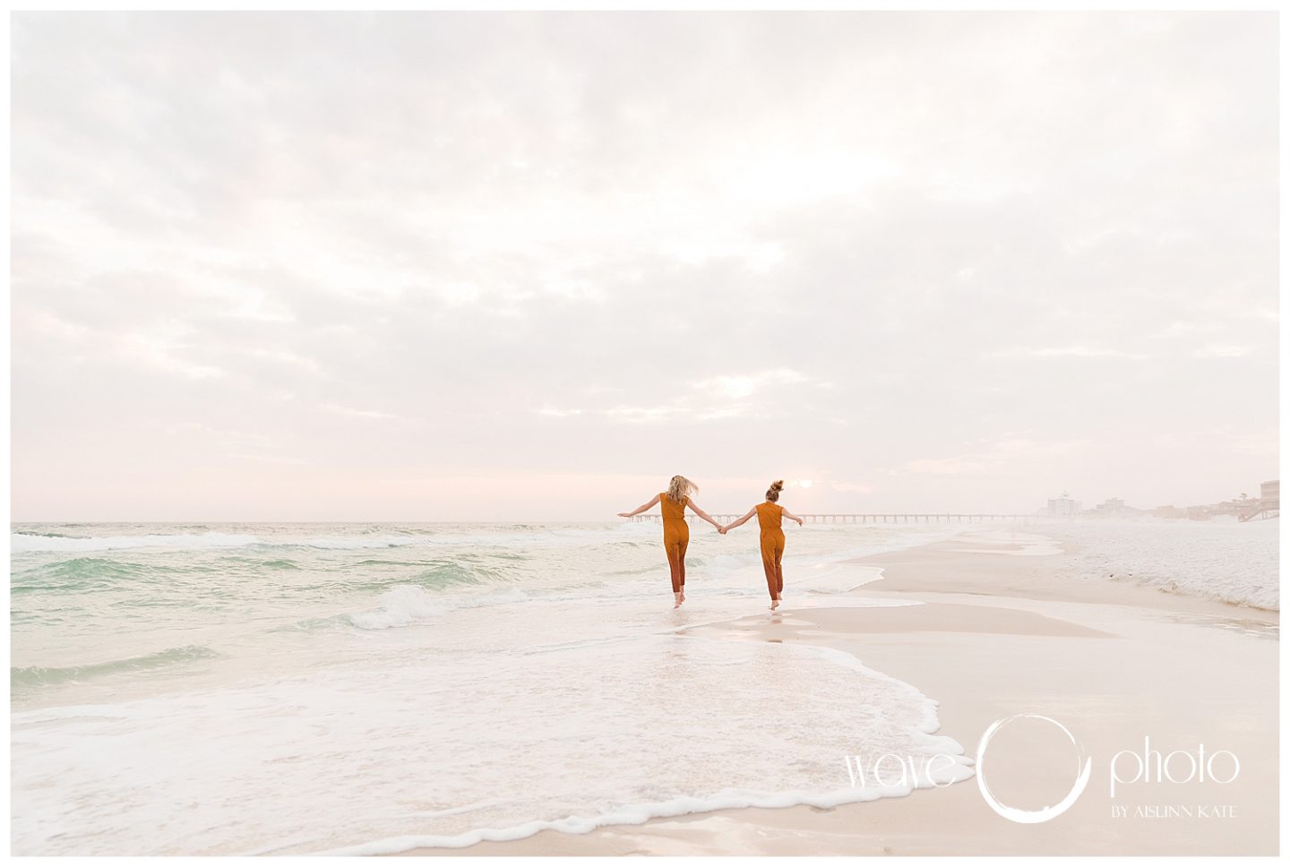 mother-daughter-holding-handson-beach-pensacola-beach-florida